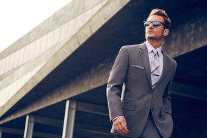The Men's Warehouse man walking in suit